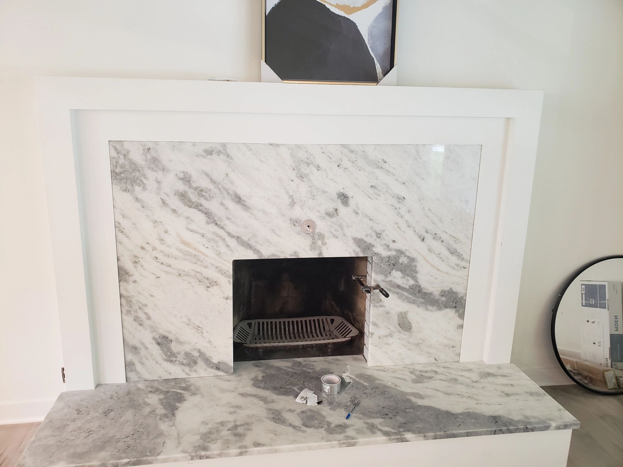 White marble fireplace surround installation