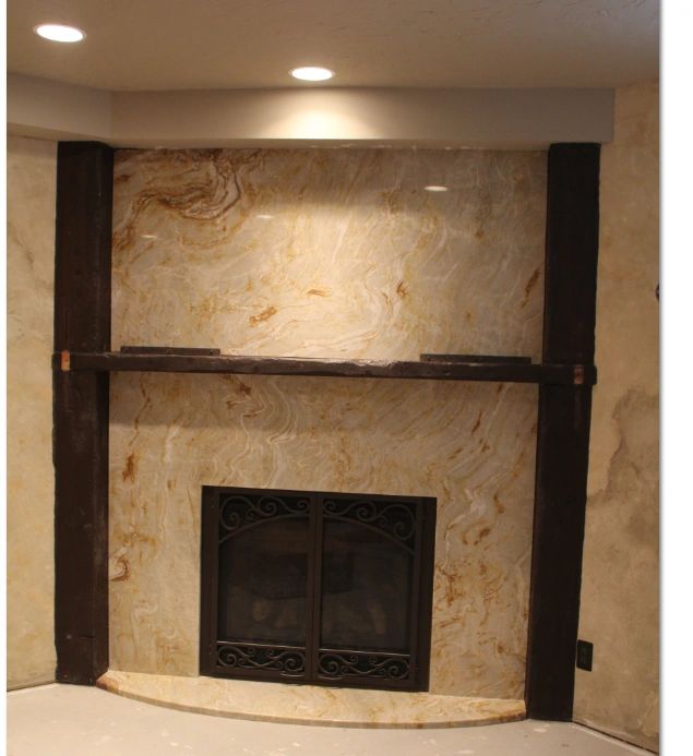 Cream marble fireplace with ornate veining — quartzite example